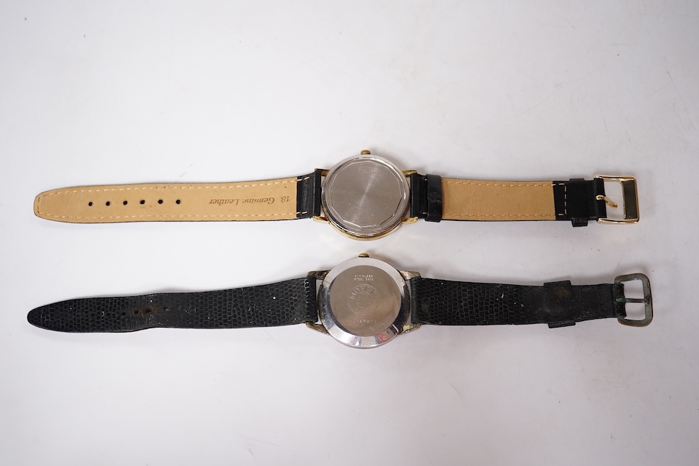 A gentleman's steel and gold plated Longines Conquest manual wind wrist watch, with baton numerals and date aperture, case diameter 35mm, together with a gentleman's stainless steel Marvin manual wind wrist watch, case d